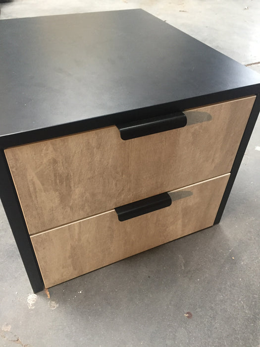100mm matte black drawer latch on brown cabinet doors