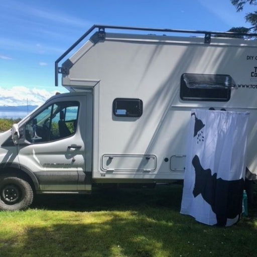 Portable shower curtain holder attached to camper front view 