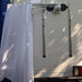 Portable show curtain holder on back of camper